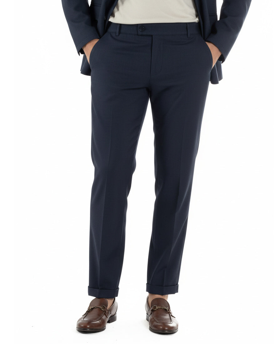 Pantaloni uomo blu con abbottonatura allungata e risvolto al fondo