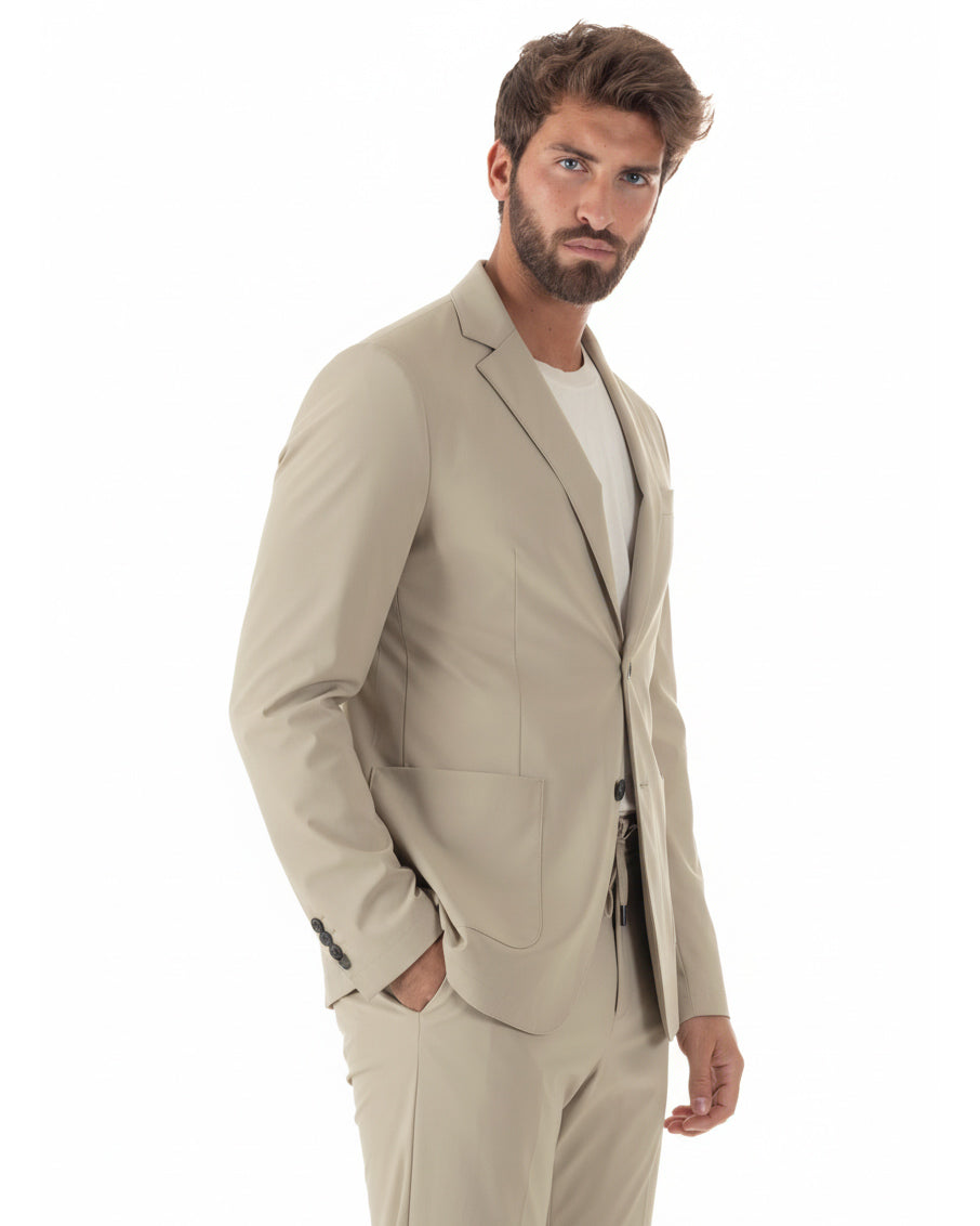 Vista laterale abito uomo beige monopetto no stiro regular fit