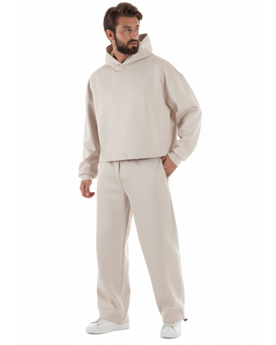 Vista laterale coordinato uomo panna felpa boxy crop pantaloni baggy fit