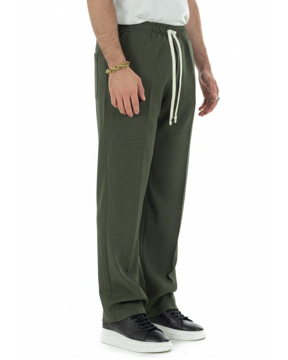 Vista laterale pantaloni uomo verde baggy viscosa morbidi fondo largo