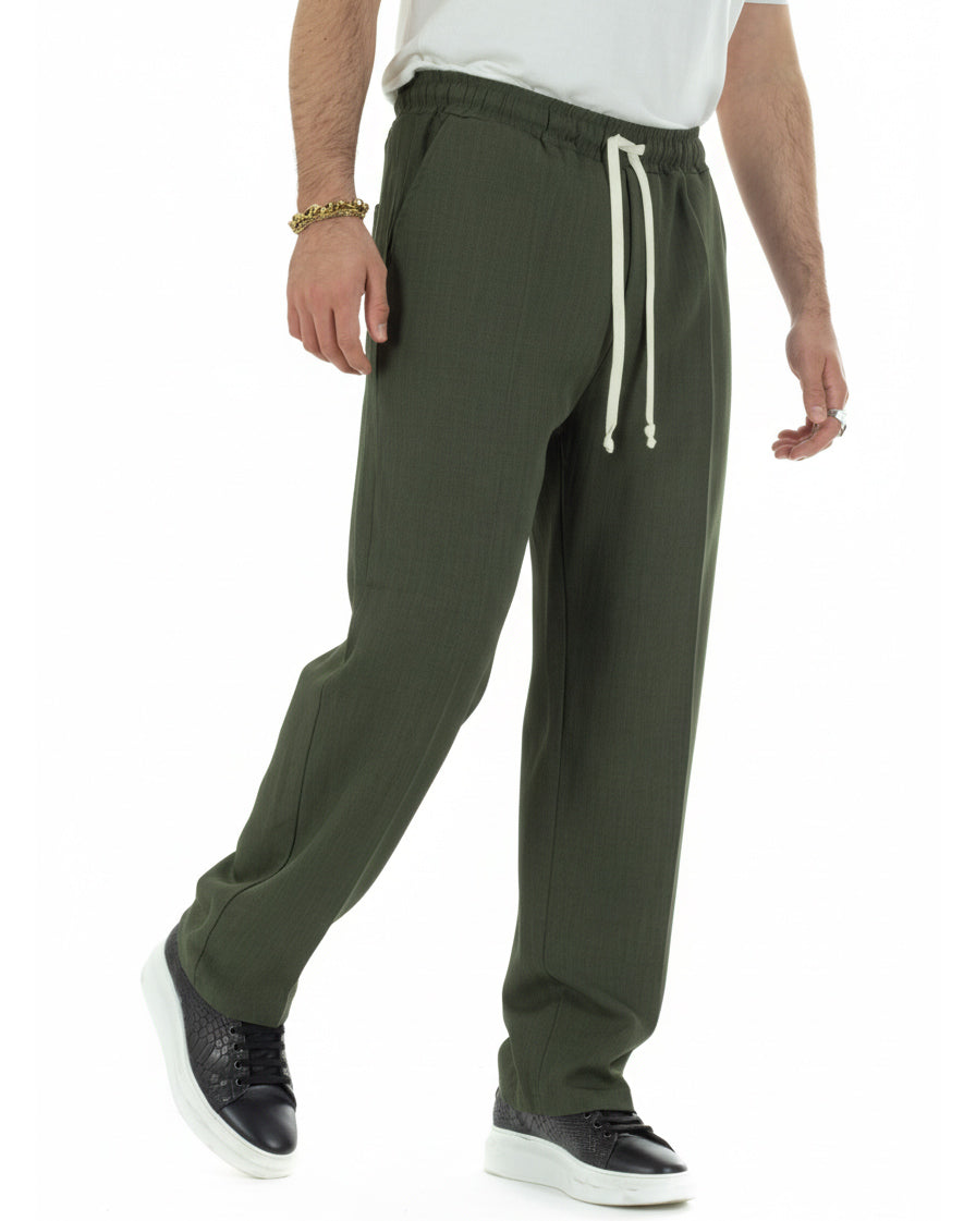 Vista frontale pantaloni baggy verde viscosa con tasche america fondo ampio