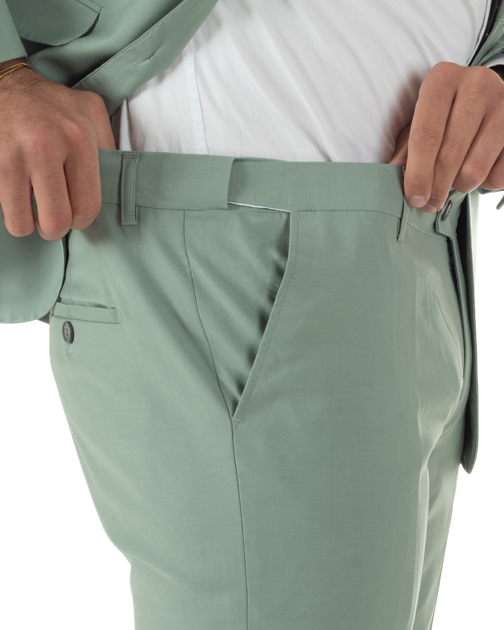 Pantaloni uomo verde salvia slim fit con abbottonatura allungata coordinati