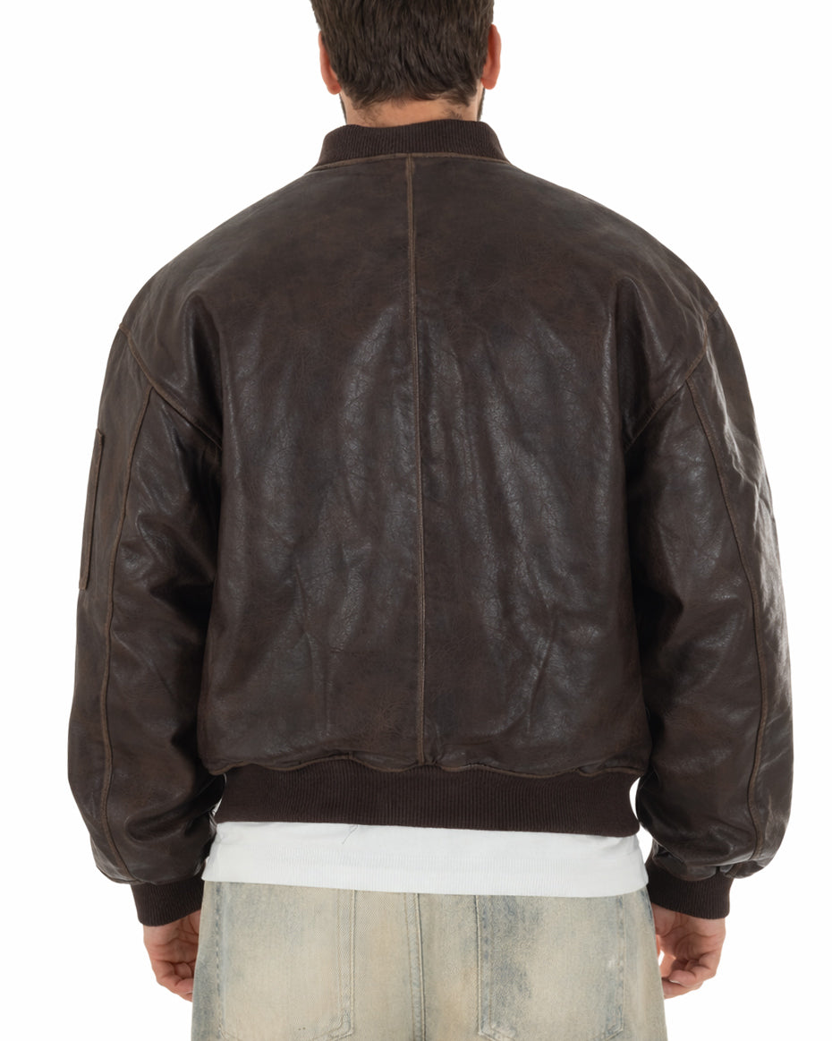 Dettaglio polsini e fondo a coste elasticizzate bomber marrone uomo