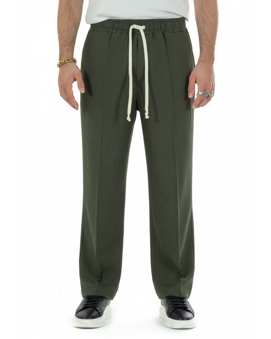 Dettaglio coulisse con laccio pantaloni verde baggy viscosa uomo