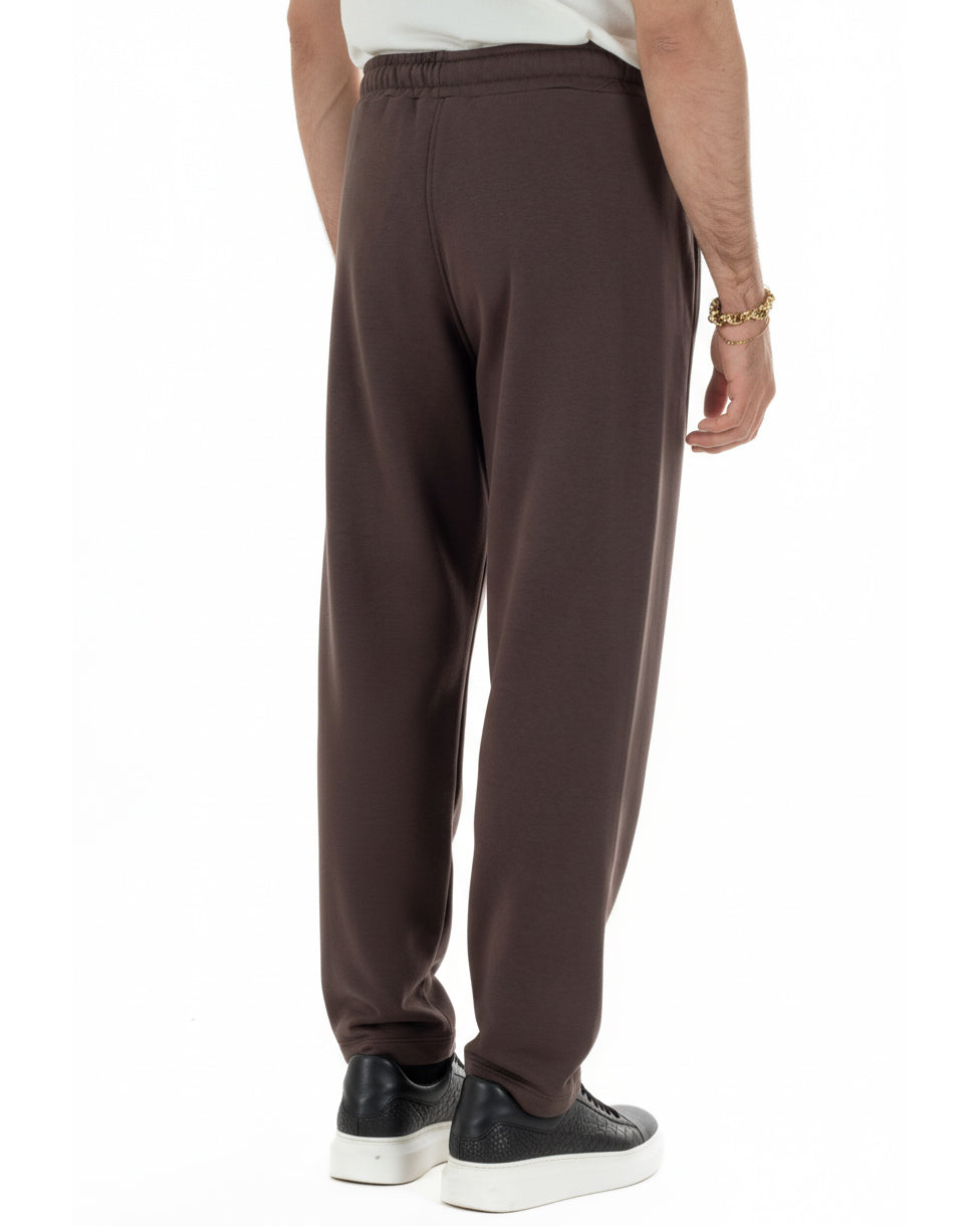 Dettaglio tessuto leggero pantaloni marrone balloon fit 65% cotone uomo
