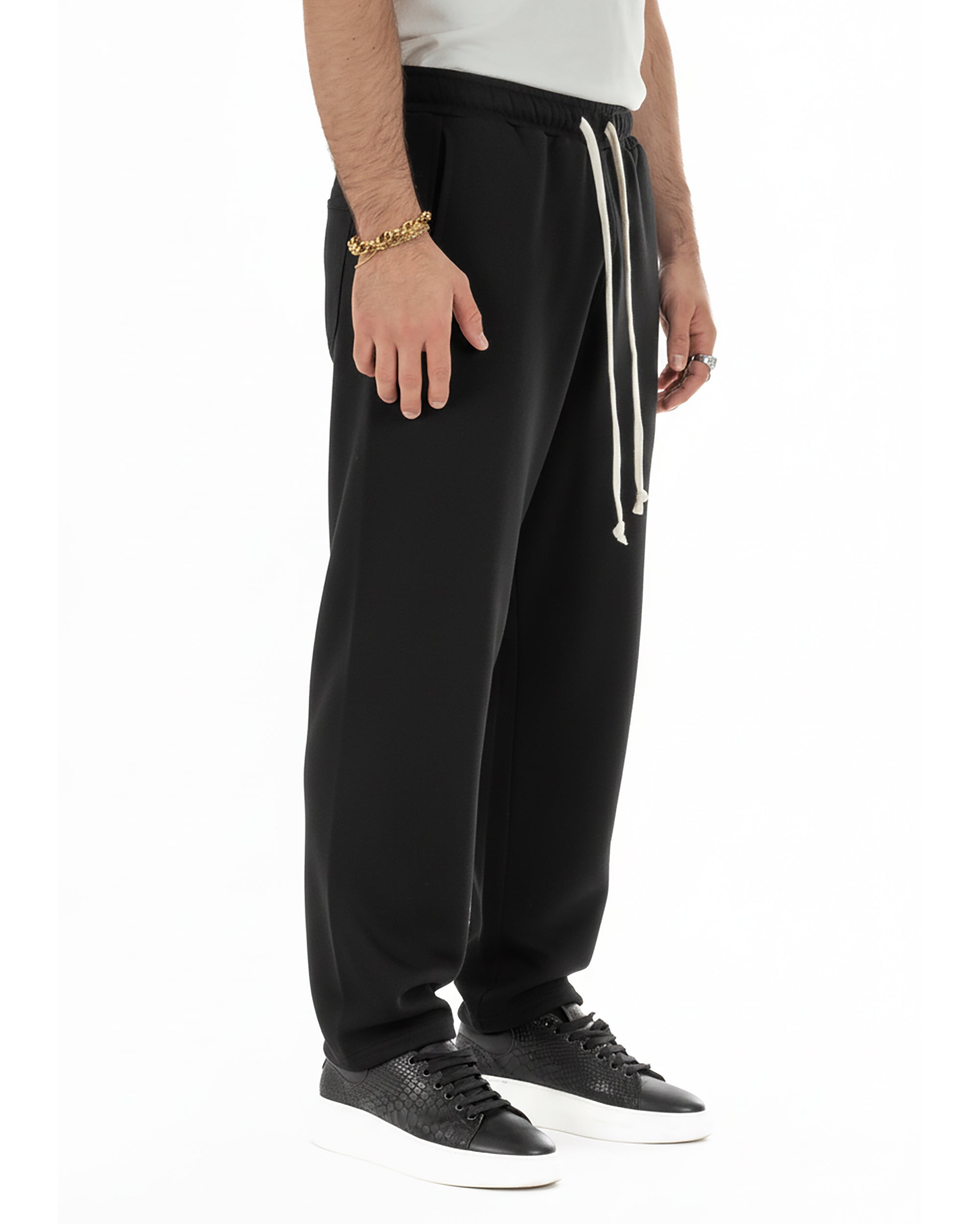 Vista completa pantaloni tuta grigio balloon fit uomo streetwear