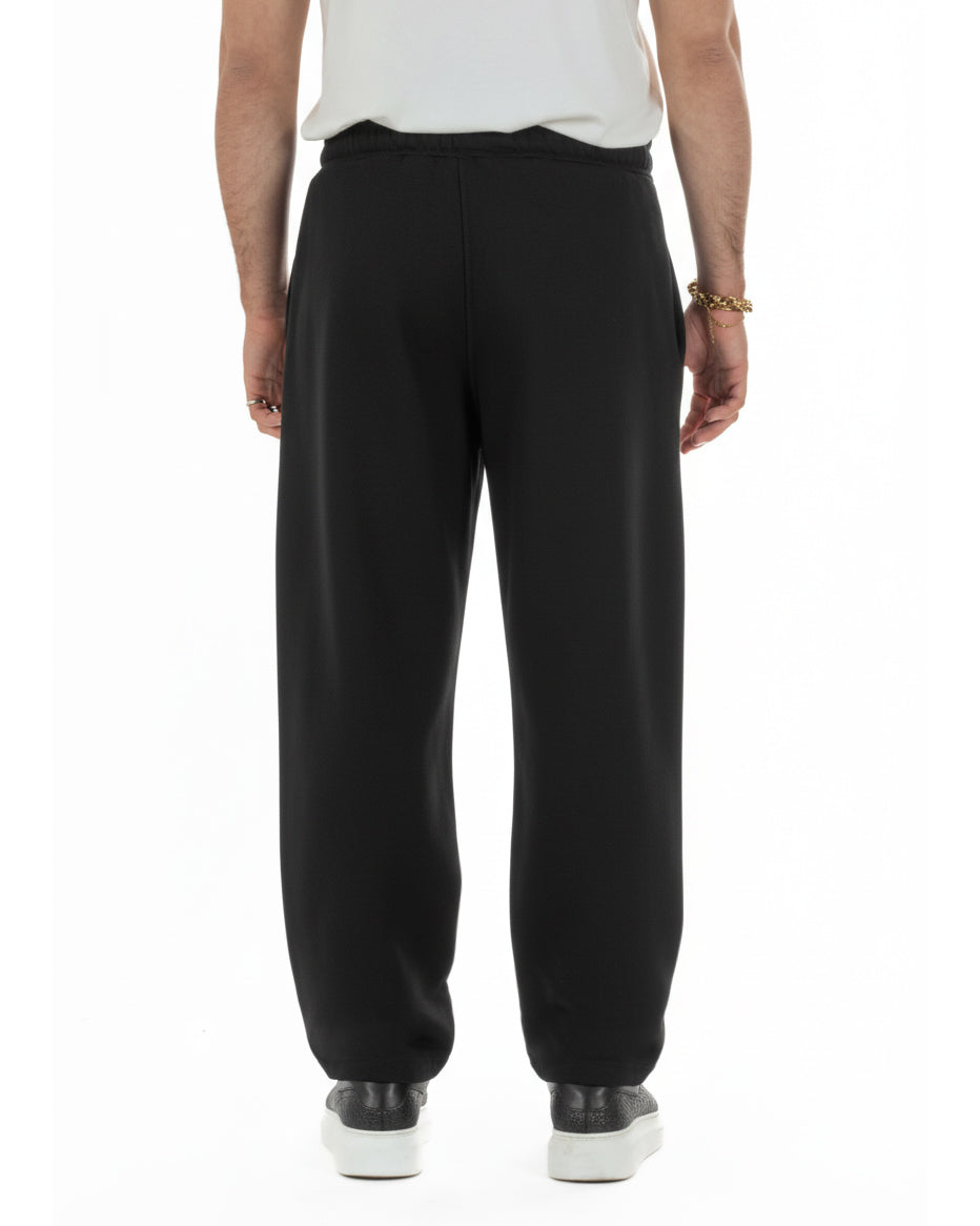 Dettaglio tessuto leggero pantaloni grigio balloon fit 65% cotone uomo