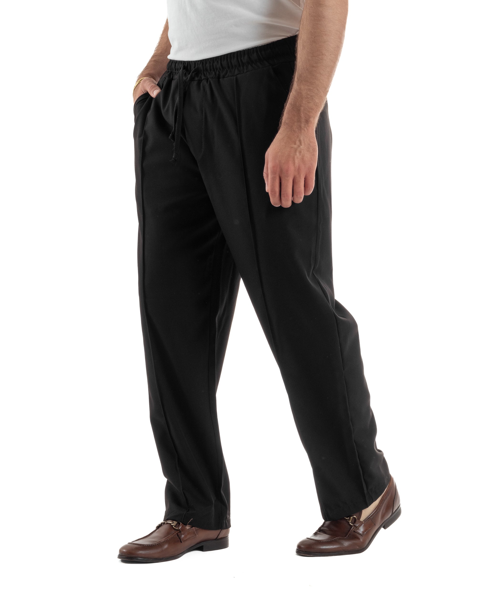 Vista frontale pantaloni neri uomo wide leg coulisse annodata nervatura sartoriale tasche filo